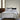 Amalia Home Collection bedding set featuring crisp white linens with elegant double-line embroidery, complemented by contrasting black accent pillows for a refined, contemporary look.